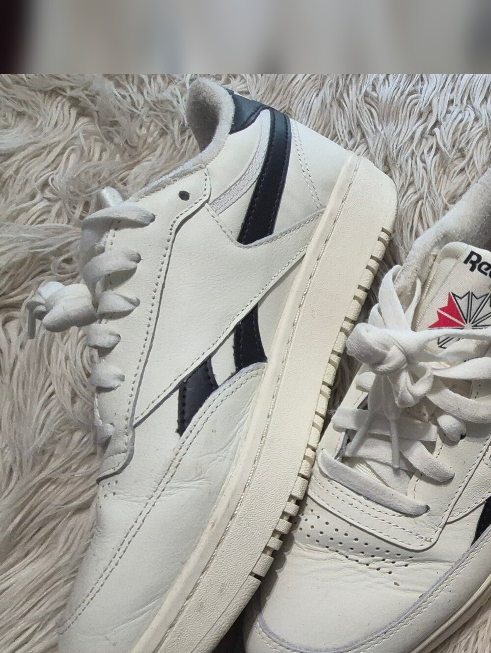 Reebok White Sneakers with Black Stripe Accents